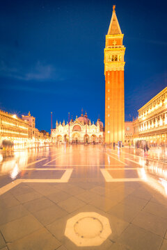 Illuminated church and tower near square