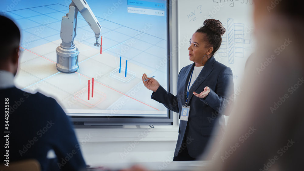 Leinwandbilder Black Teacher Explains Engineering to Students During University Robotics Lecture. She Uses Interactive Whiteboard. Group of Engineers Listen About Program Development for Robotic Arm in Classroom.