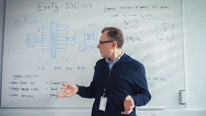 Professional Male Teacher Gives Presentation, Uses Whiteboard with Technical Information and Charts to Illustrate Solution Options During Video Call. E-Learning and Online Education Concept.