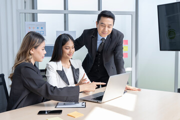 Group of Asian business men and women in Thailand Working together at the company's office for a joint consultation meeting.