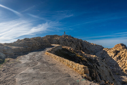 The old lighthouse on the rocky Pietra peninsula in the L'Ile-Rousse commune of France on Corsica, France