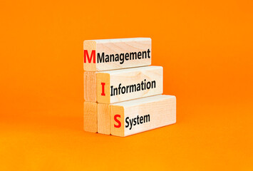 MIS management information system symbol. Concept words MIS management information system on wooden blocks on beautiful orange background. Business MIS management information system concept Copy space © Dzmitry
