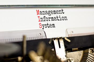 MIS management information system symbol. Concept words MIS management information system typed on retro typewriter. White background. Business MIS management information system concept. Copy space © Dzmitry