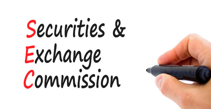 SEC securities and exchange commission symbol. Concept words SEC securities and exchange commission on white background. Businessman hand. Business SEC securities exchange commission concept.