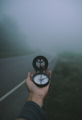 compass on foggy road