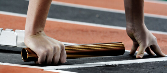 Runner Running a Race on Track with Baton Relay Team Score