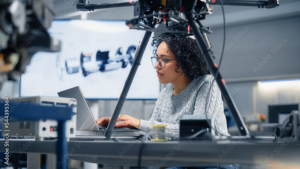 Poster Concentrated Black Female Engineer Writing Code. Developing Software for Drone Control in the Research Center Laboratory. Technological Breakthrough in Flight Industries Concept.