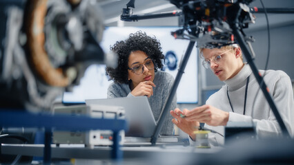Diverse Engineers Discussing New Powerful Microchip to Put it Inside the Modern Drone....
