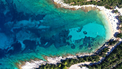 Aerial drone top view photo of exotic paradise beach of Emblisi with turquoise and emerald clear sea near iconic Fiskardo bay, Cefalonia island, Ionian, Greece
