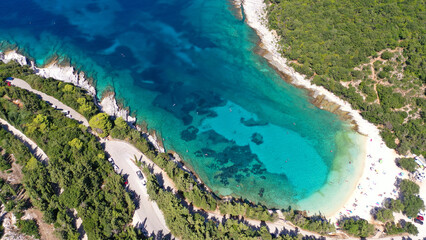 Aerial drone top view photo of exotic paradise beach of Emblisi with turquoise and emerald clear sea near iconic Fiskardo bay, Cefalonia island, Ionian, Greece