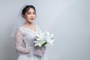 Portrait of asian woman wear bride with flower on white background,Wedding concept