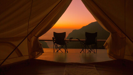 Going out from tourist tent with mountain view on amazing sunrise