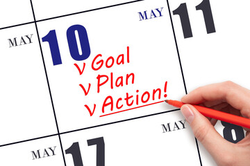 Hand writing text GOAL PLAN ACTION on calendar date May 10. Motivation for a new day. Business concept.