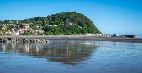Fototapeta na wymiar Minehead beach at low tide looking towards North Hill on a summer day