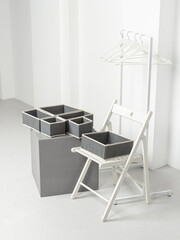 Set of laundry organizers for wardrobe of different sizes. Concept of order in house. Empty gray closet organizers drawer divider. Dressing room. Vertical