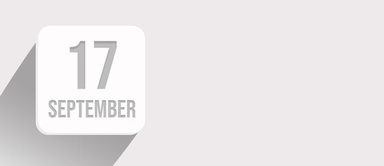 September 17th. Day 17 of month, Calendar date. Calendar leaf icon on white with sunlight and long shadow, flat design. Autumn month, day of the year concept.