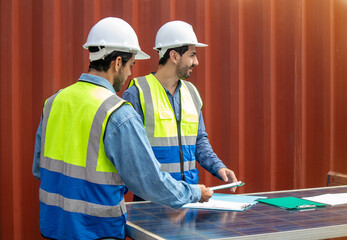 Two male technicians engineers working together  at the workplace