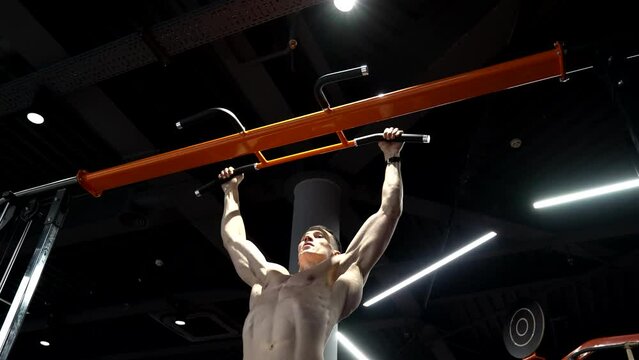 pullup. strong athlete practicing pullup in sport gym. athlete do pullup workout. athlete pull up