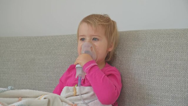 Adorable Caucasian Baby Girl Inhaling Medicine Steroids to Recover Respiratory Disease