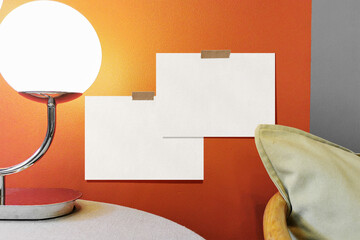 Clean minimal A5 flyer mockup on the wall with lamp and chair background