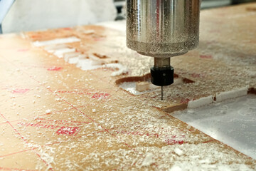 CNC cutter machine High Efficiency in action, cuting off plastic material. Machine working CNC.