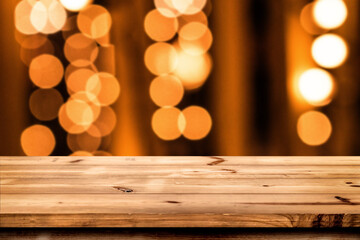 Empty wooden table for product placement or montage with focus to the table top blurred bokeh background, suitable for montage product