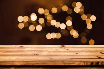 Empty wooden table for product placement or montage with focus to the table top blurred bokeh background, suitable for montage product