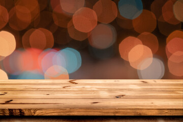 Empty wooden table for product placement or montage with focus to the table top blurred bokeh background, suitable for montage product