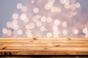 Empty wooden table for product placement or montage with focus to the table top blurred bokeh background, suitable for montage product