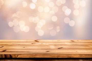 Empty wooden table for product placement or montage with focus to the table top blurred bokeh background, suitable for montage product