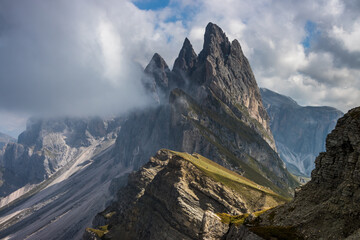 Clouds over mountain massif Odle in Dolomites