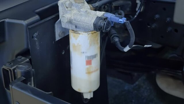 Truck diesel fuel filter on car frame. Shot in motion. Closeup