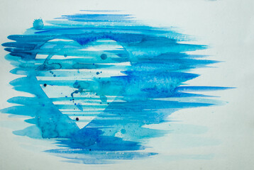 Watercolor drawing heart shape in blue colors on white paper.
