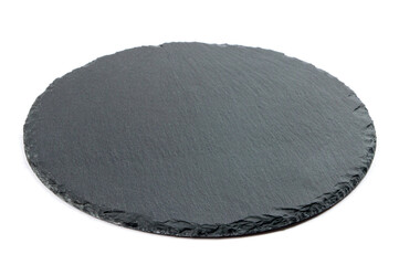 black slate round board for serving cheese and snacks on a white background