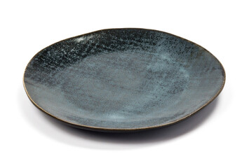 ceramic dark blue flat round plate with black blotches (dots, paint splashes, spots) close-up on white background