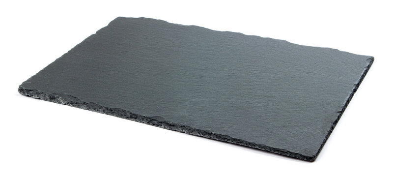 black slate serving board for serving cheese and snacks on a white background