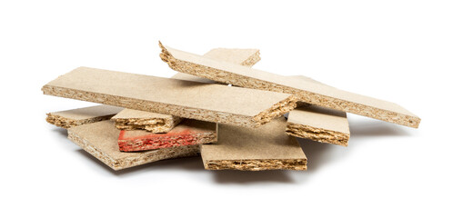 a pile of broken untreated mdf slabs of brown color on a white background close-up