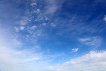 Fluffy white clouds in a blue sky 