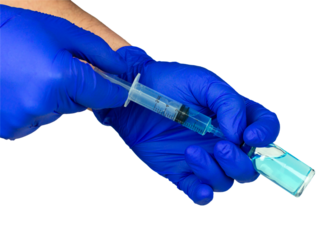 We draw out the injection liquid or vaccine with a syringe. Doctor's hands in blue gloves draw a solution into a syringe from an ampoule