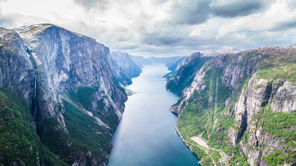 Breathtaking aerial drone view into the Lysefjorden in Norway on a cloudy summer day - obrazy, fototapety, plakaty