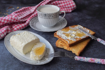 Turkish breakfast with cream (butter cream) and pine honey and milk in a cup