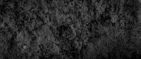 Fototapeta na wymiar black limestone wall with visible details. background