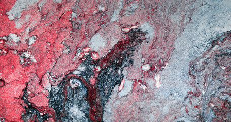 Color marble texture. Art abstract background. Paint blend. Red rose pink blue gray grain particles...