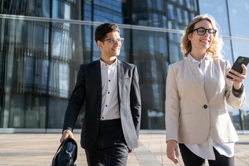 Businessmen people a man and a woman work in the office go to the office.