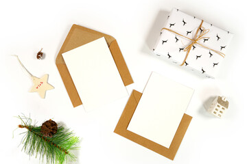 Christmas holiday two sides greeting card, party invitation mockup styled with minimalist Scandi theme gifts and accessories against a white background.