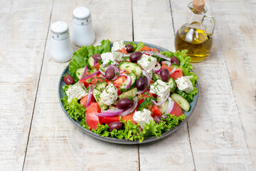 Greek salad with fresh vegetables, feta cheese and olive oil.	
