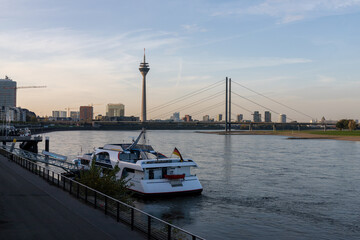Fototapeta na wymiar View of the Dusseldorf TV tower with bridge, river and ships