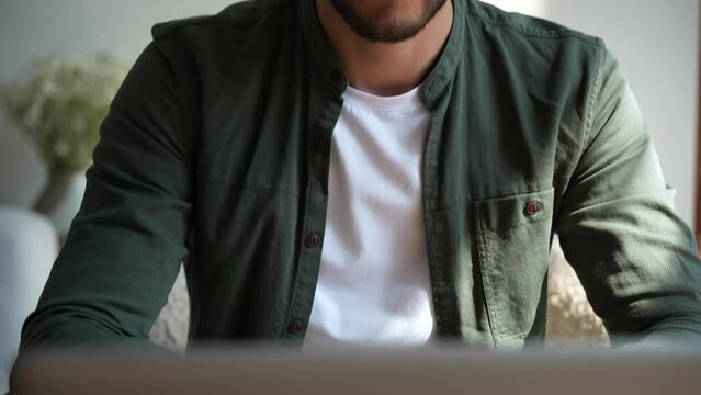 Smiling bearded millennial professional businessman using laptop and looking at camera. Happy confident handsome smart young adult entrepreneur, leader, manager posing. Close up face view business por