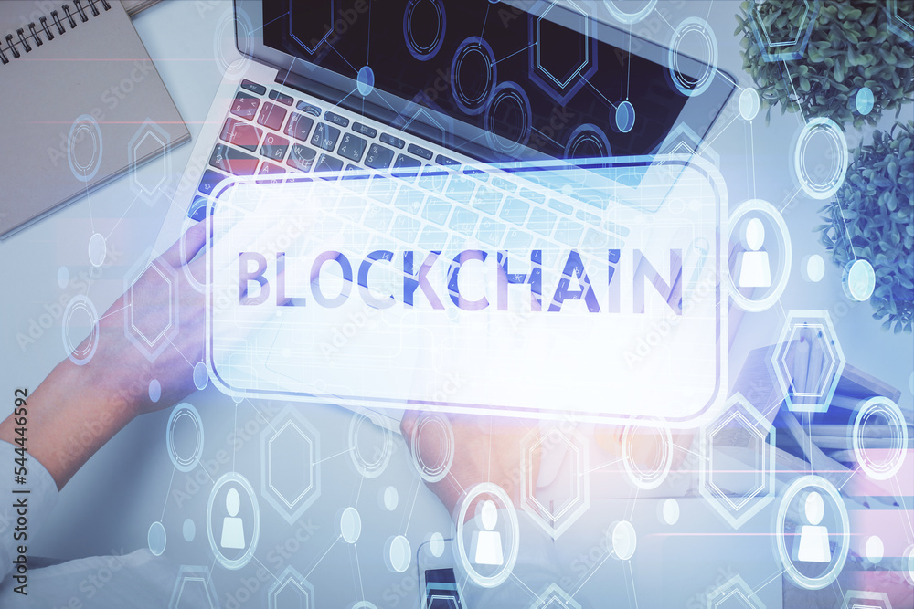 Poster double exposure of woman hands working on computer and blockchain theme hologram drawing. top view. 