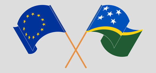 Crossed and waving flags of the European Union and Solomon Islands